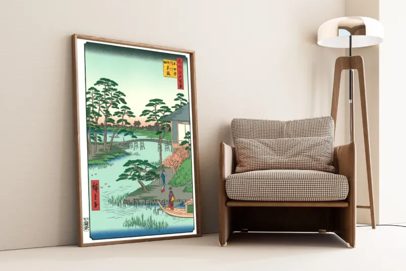 Mokuboji Temple and Vegetable Fields on Uchigawa Inlet by Utagawa Hiroshige — framed and leaning against a wall beside an armchair and a floor lamp